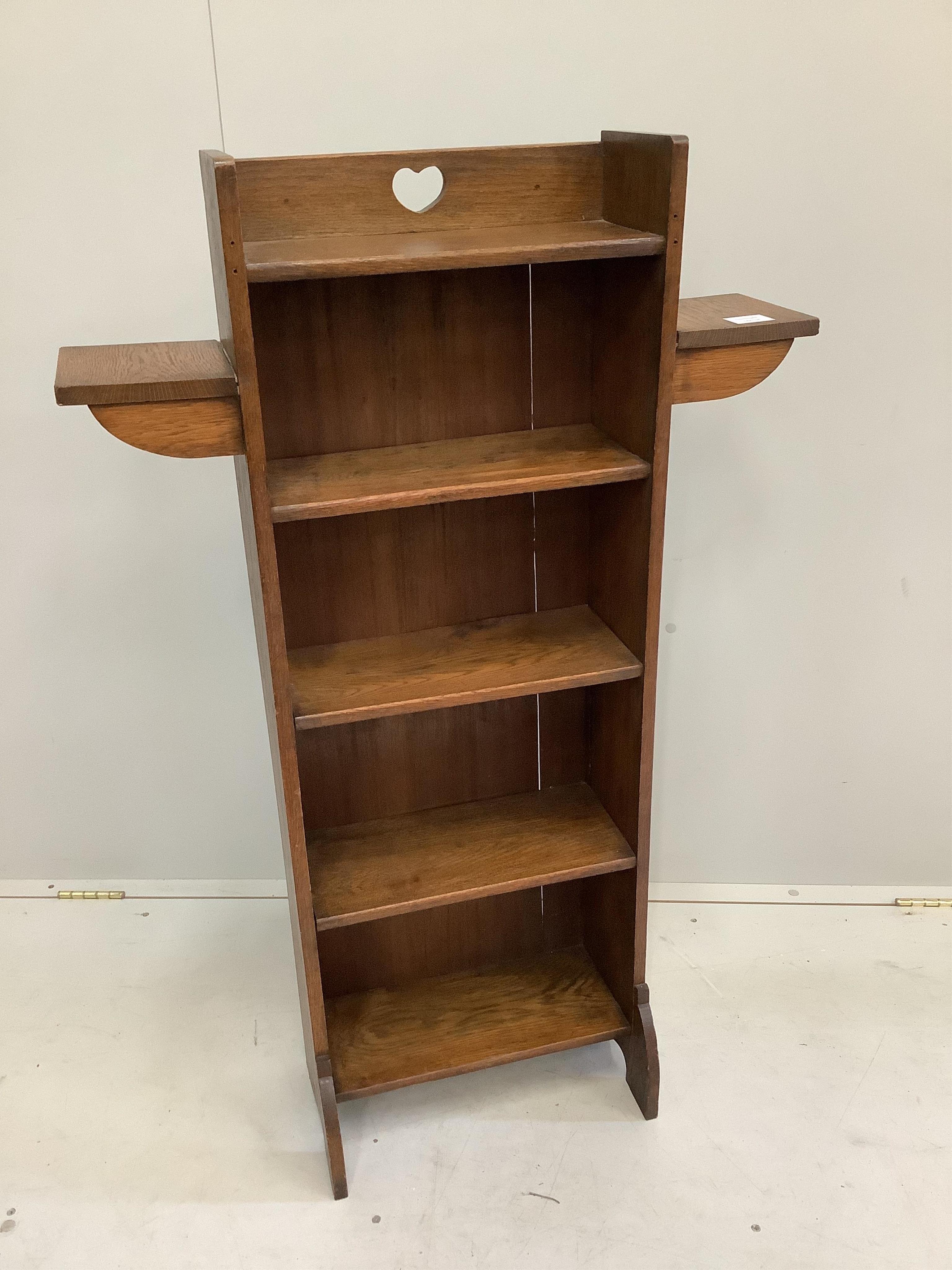 An Arts & Crafts oak open bookcase, width 71cm, depth 17cm, height 113cm